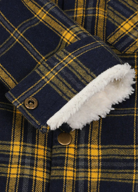 Close-up of the interior of kids bold yellow flannel jacket with cuff