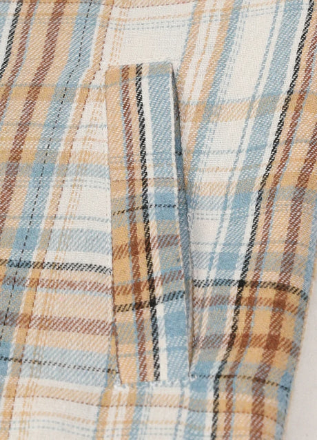 Detail of kids blue beige flannel jacket with warm hand pocket