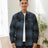 A man in a deep blue men's fleece lined flannel shirt jacket