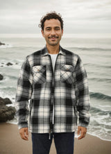 A man standing on the beach in a midnight snowfall men's fleece lined flannel shirt jacket