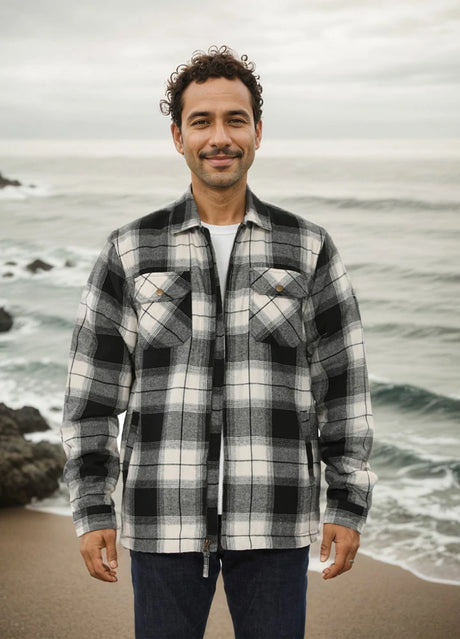 A man standing on the beach in a midnight snowfall men's fleece lined flannel shirt jacket