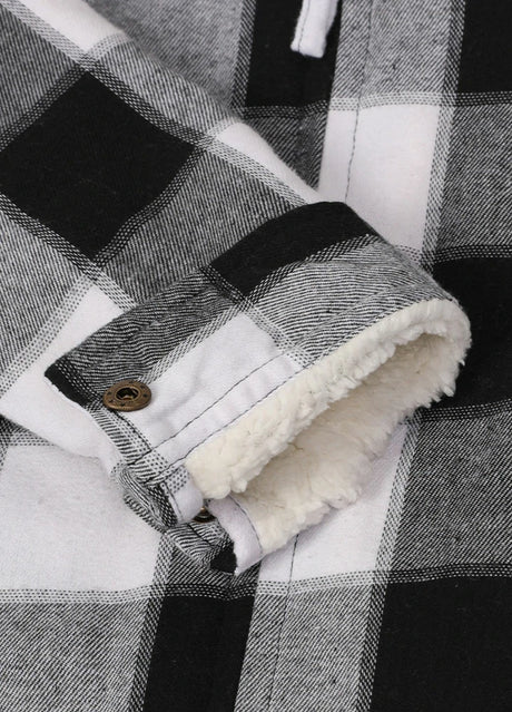  Close-up of the interior of kids black grey warm flannel jacket with cuff