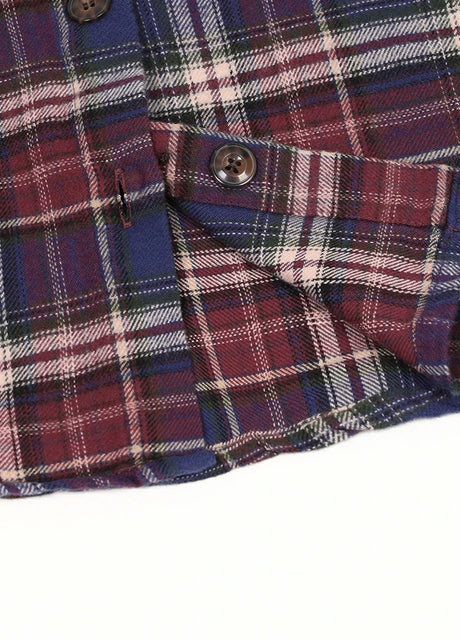 Detailed view of blueberry red kids flannel plaid shirt with shirttail hemline