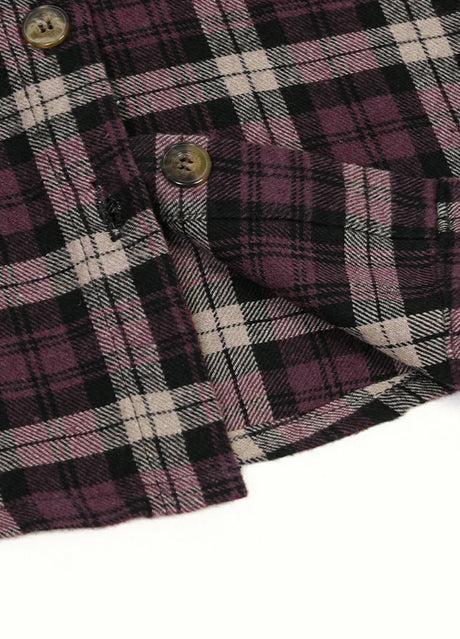 Detailed view of shirttail hemline on kids crimson blush flannel plaid shirt