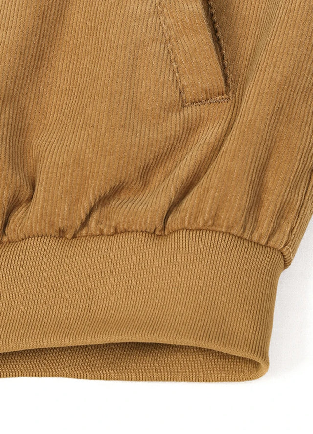 Close-up of the hem of a camel brown winter corduroy solid jacket for men