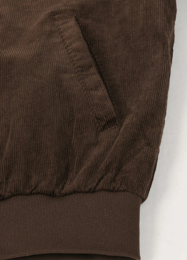 Close-up of the hem of a vintage brown winter corduroy solid jacket for men