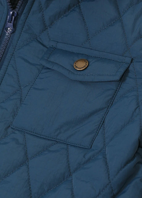 Detail of kid's navy zip-up shirt jacket pocket with button