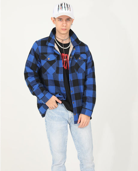 A boy in a hat wearing a checkered blue flannel shacket