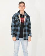 A boy who wears a kids light checkered blue black flannel shacket